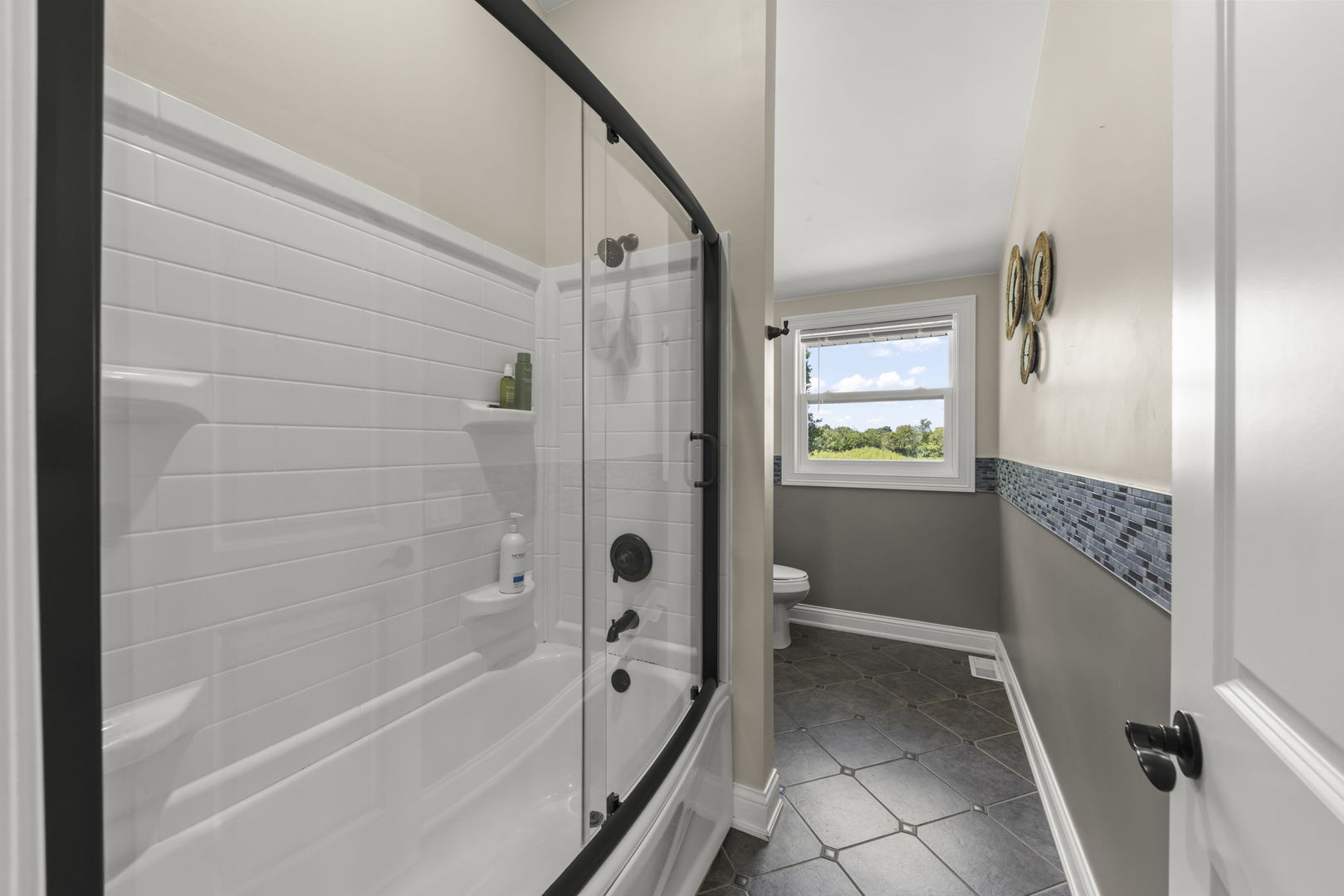 10N862 Muirhead Road Elgin, IL 60124 - Photo 25 of 47 a bathroom with a bathtub and a shower