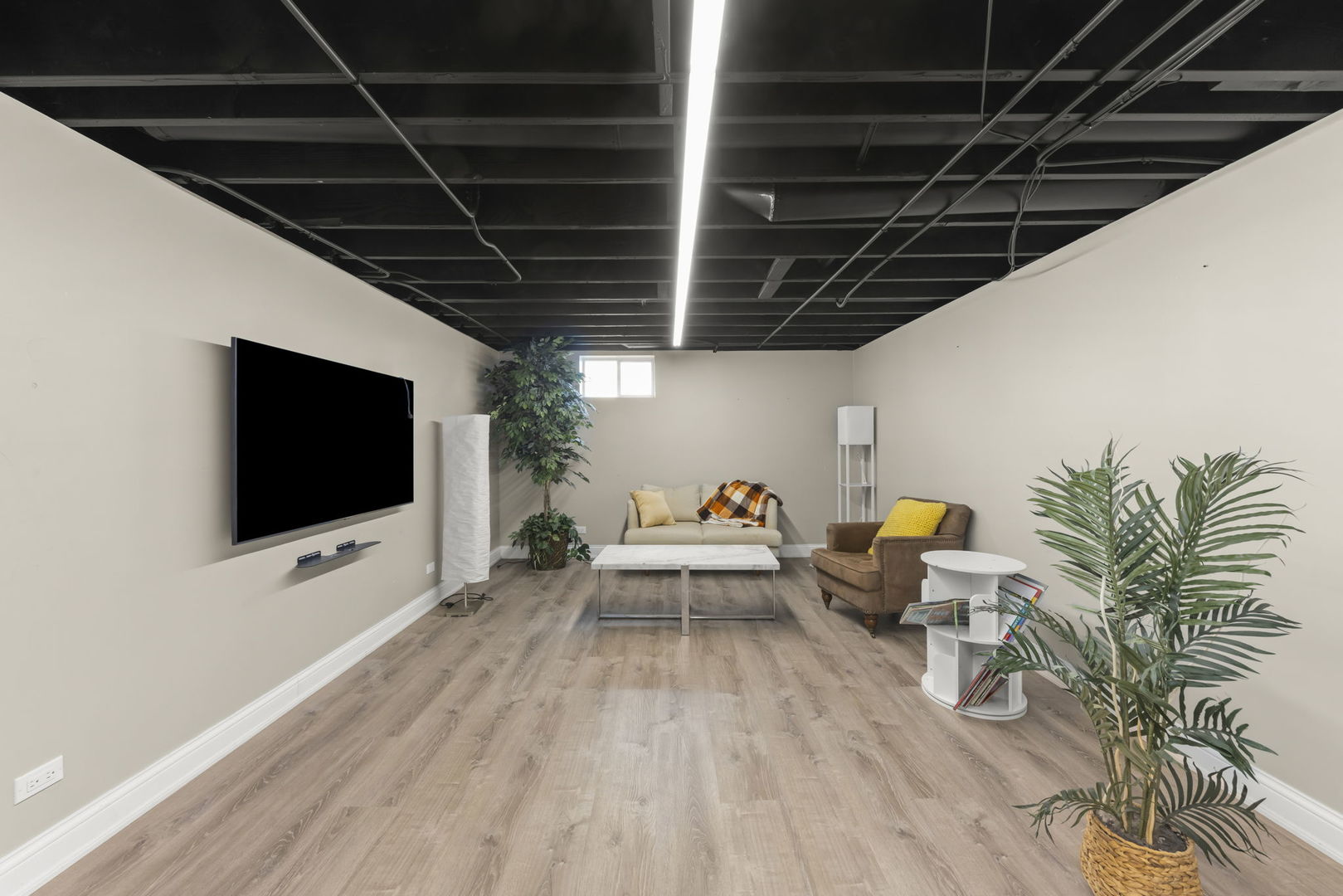 10N862 Muirhead Road Elgin, IL 60124 - Photo 28 of 47 a living room with patio furniture and a flat screen tv