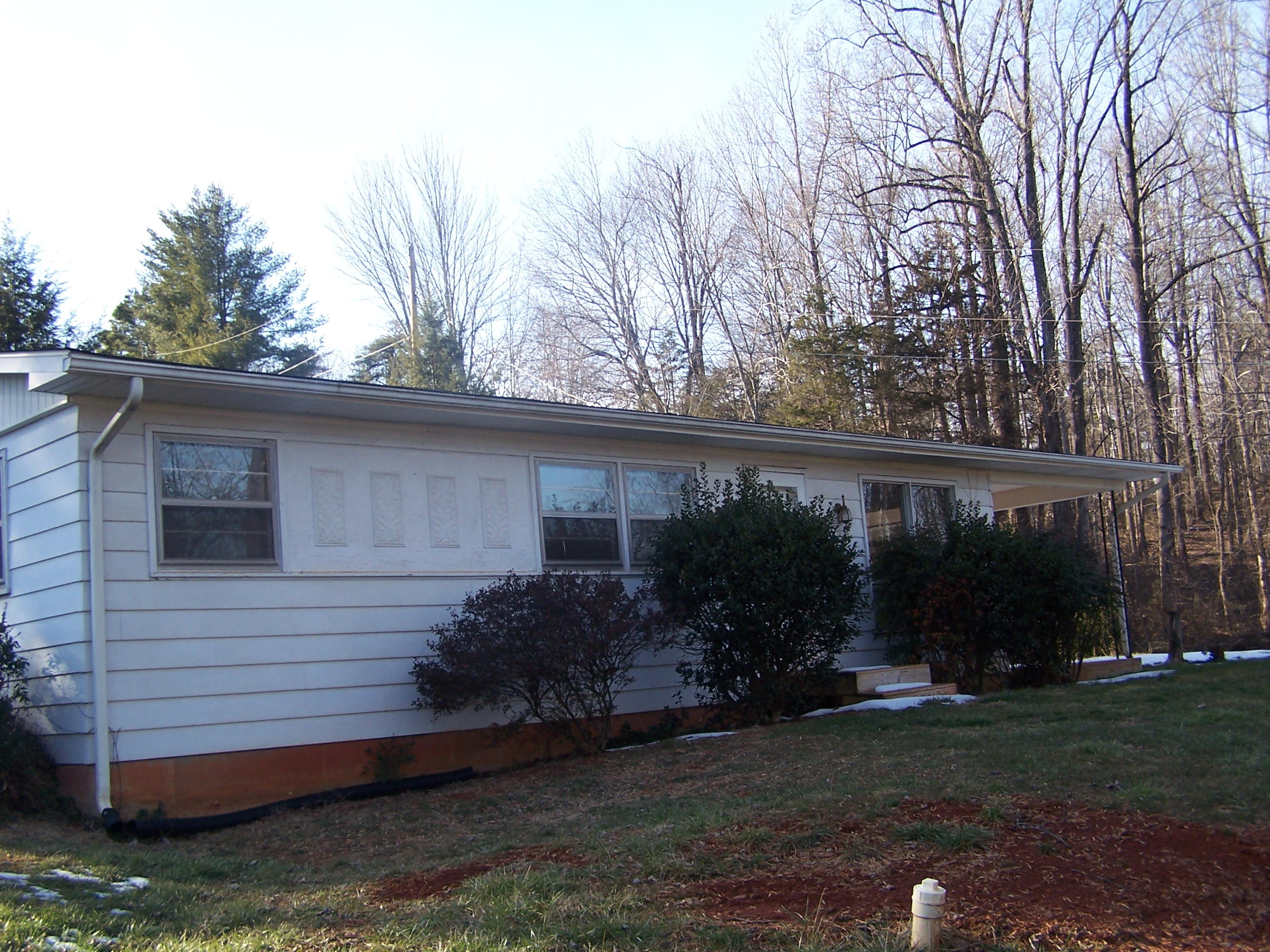 250 Muse Field Road Rocky Mount, VA 24151 - Photo 4 of 23 a view of a house with backyard and garden