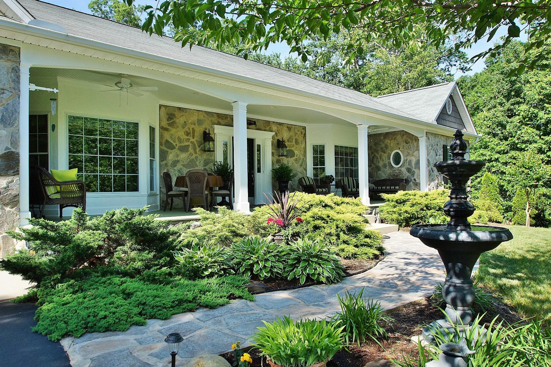 12979 Hardy Road Hardy, VA 24101 - Photo 2 of 36 front view of a house with a flower garden