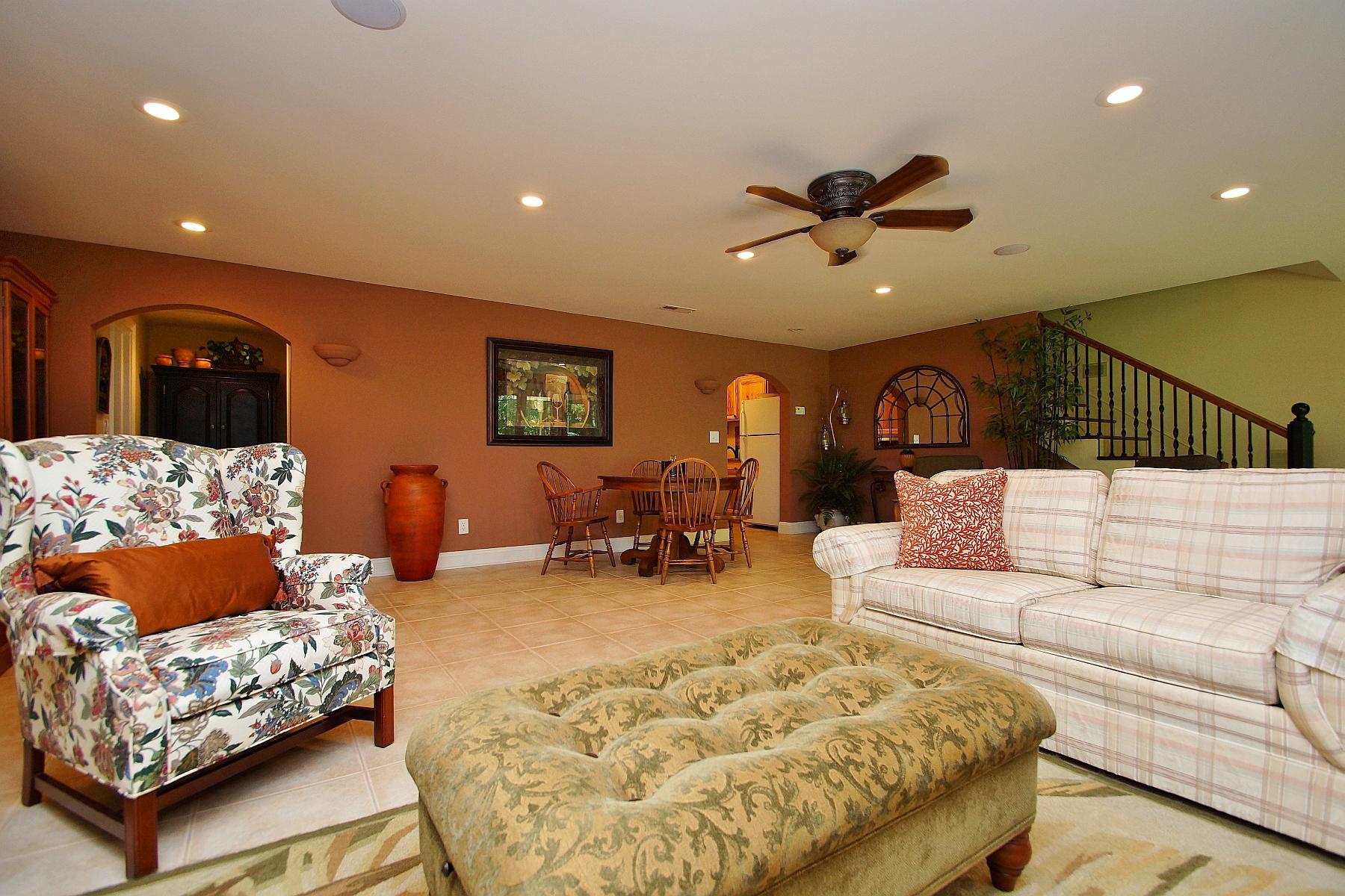 12979 Hardy Road Hardy, VA 24101 - Photo 20 of 36 a living room with furniture ceiling wooden floor and a chandelier