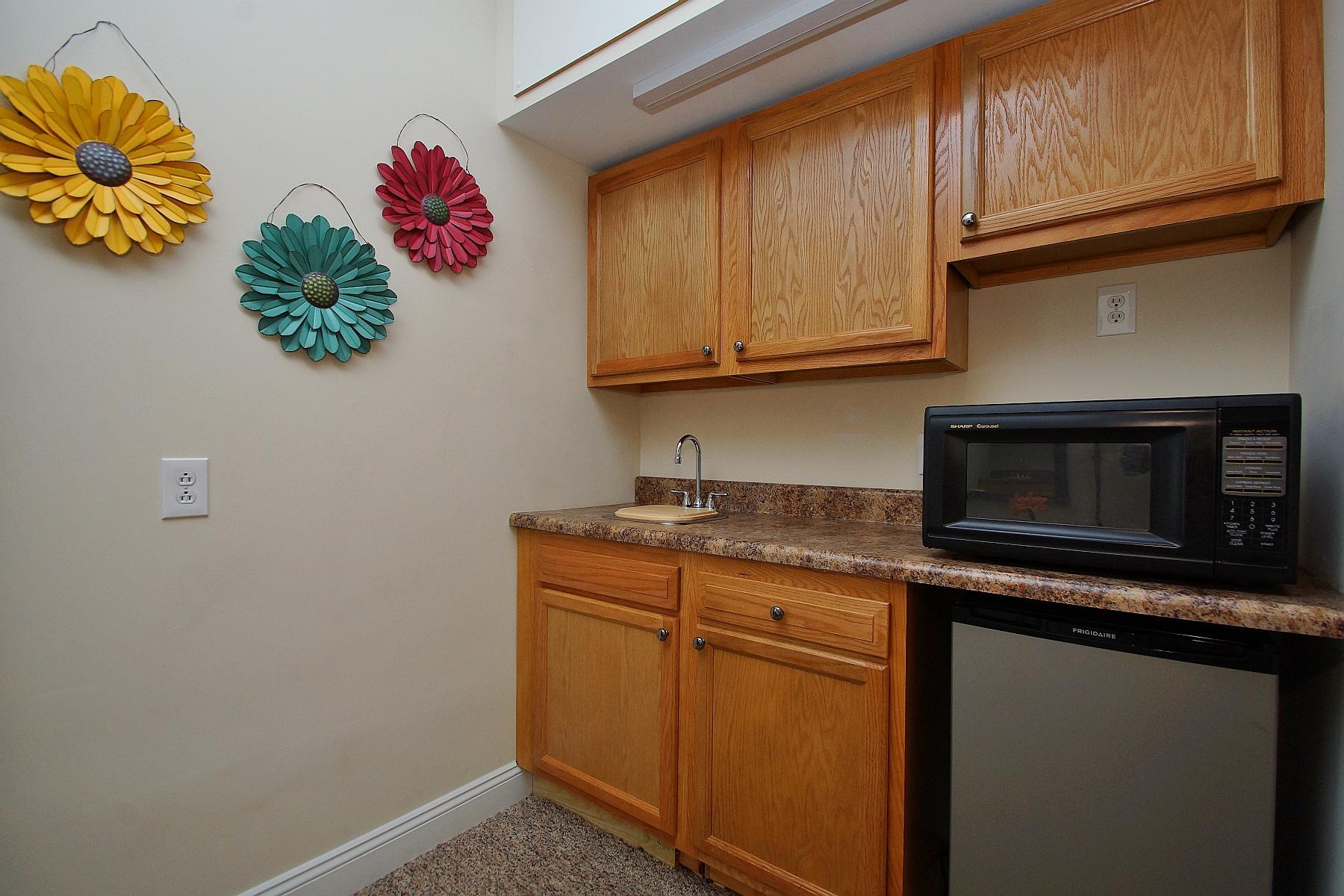 12979 Hardy Road Hardy, VA 24101 - Photo 32 of 36 a kitchen with stainless steel appliances granite countertop a sink and a microwave