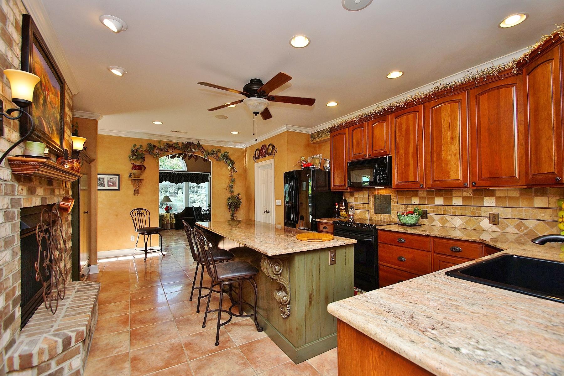 12979 Hardy Road Hardy, VA 24101 - Photo 9 of 36 a kitchen with stainless steel appliances kitchen island granite countertop a table chairs sink and cabinets