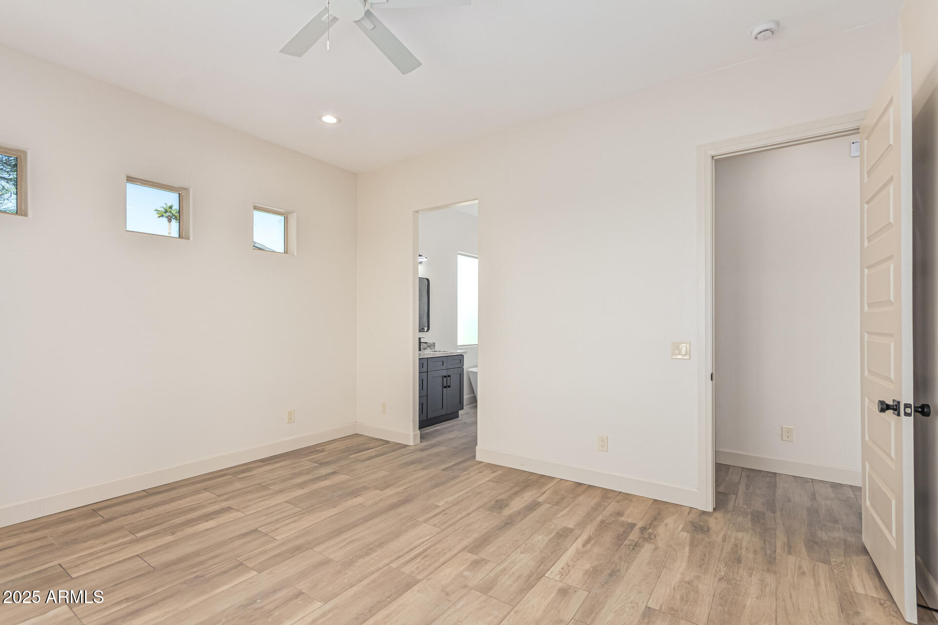 14730 South Rory Calhoun Road Arizona City, AZ 85123 - Photo 15 of 43 wooden floor in an empty room with a window