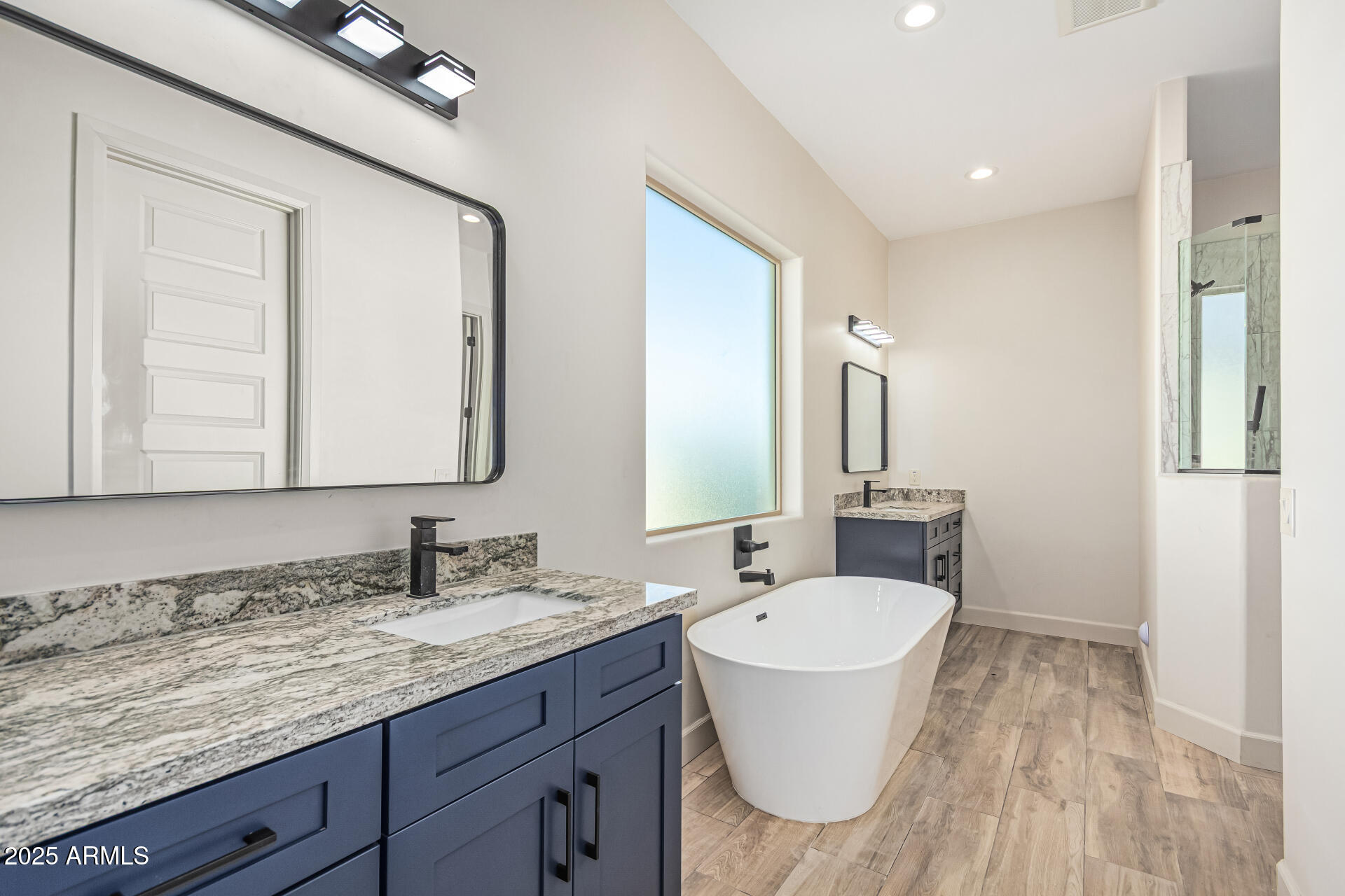 14730 South Rory Calhoun Road Arizona City, AZ 85123 - Photo 17 of 43 a bathroom with a granite countertop sink and a mirror