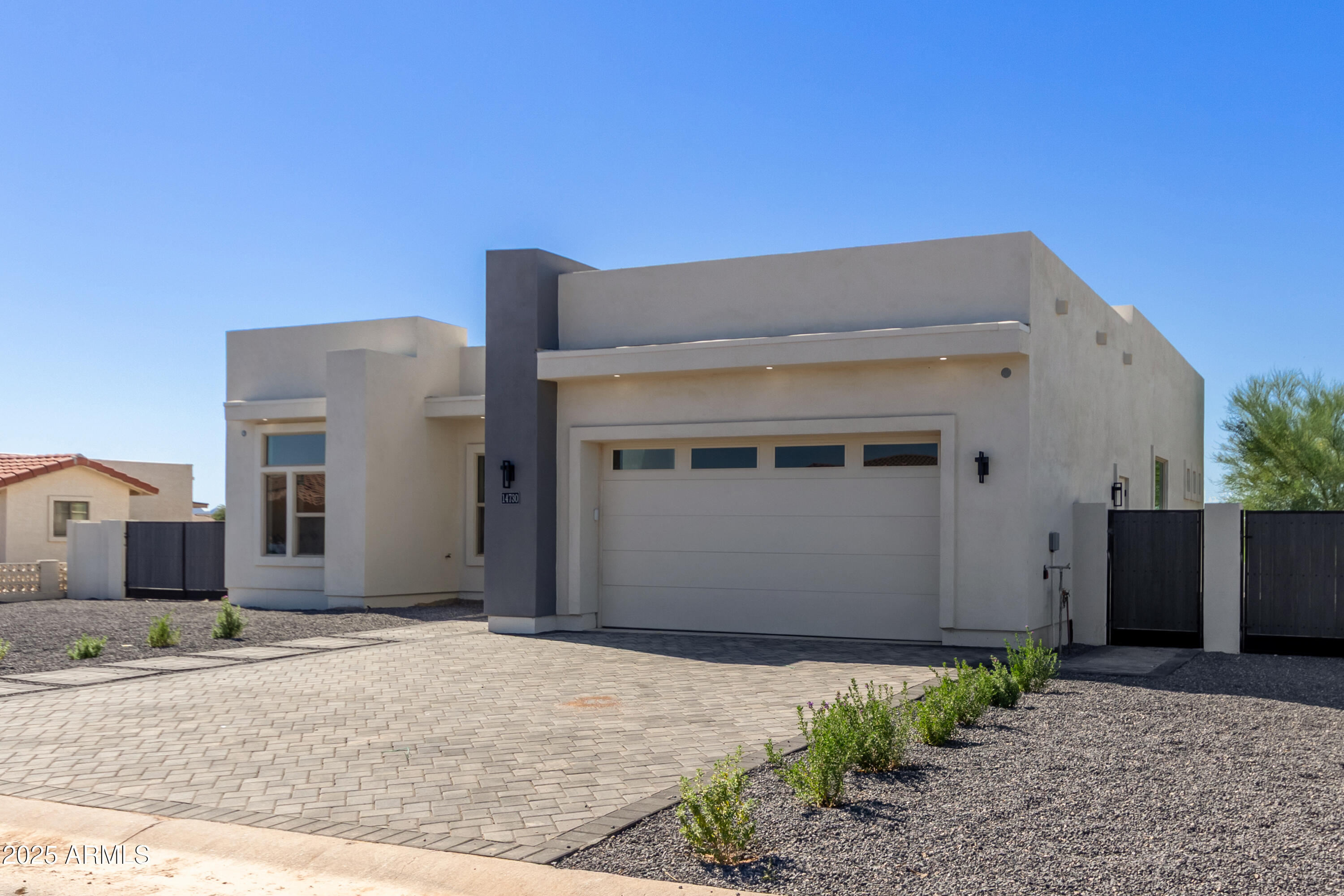 14730 South Rory Calhoun Road Arizona City, AZ 85123 - Photo 2 of 43 a front view of a house with a garage