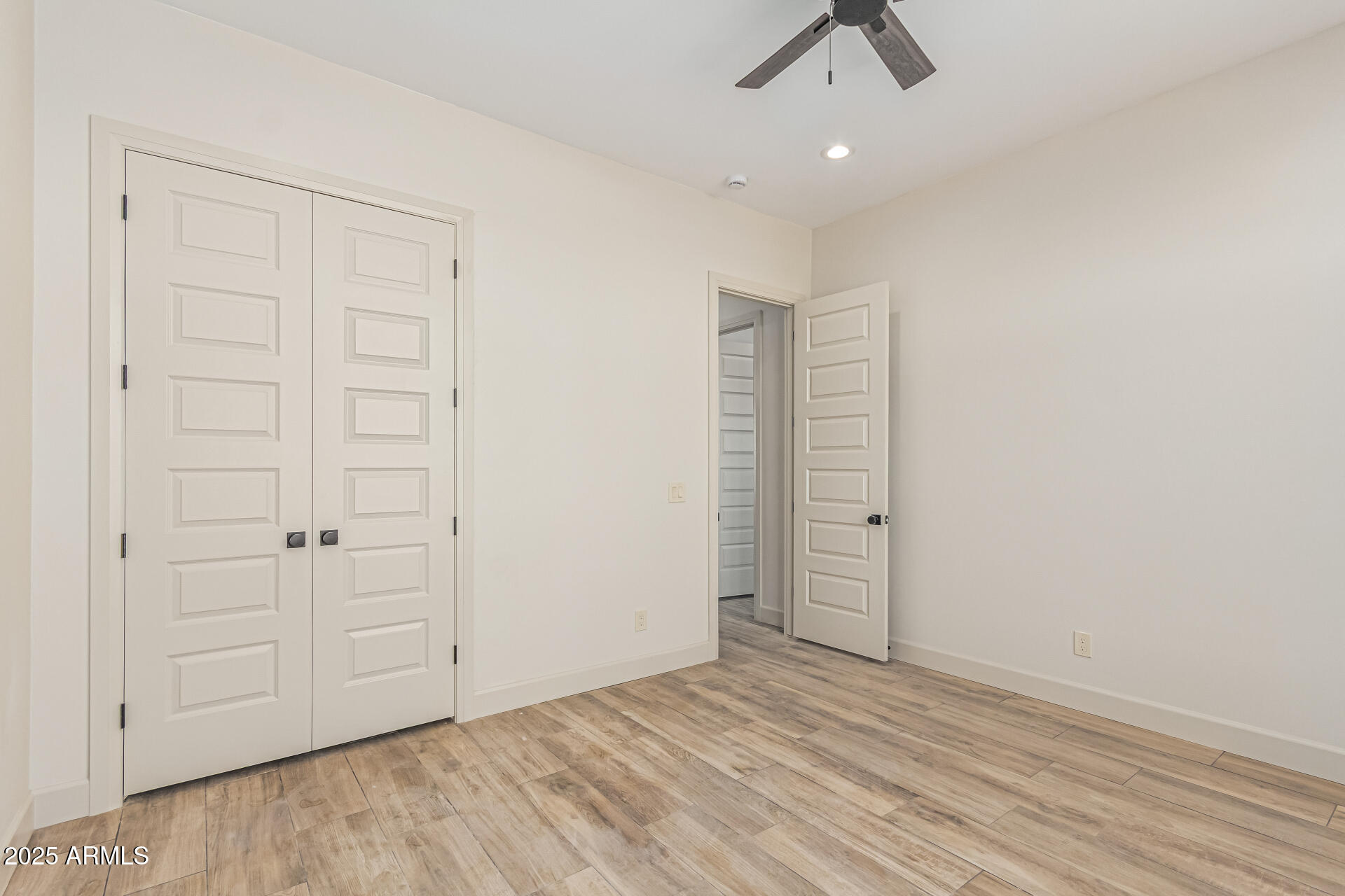 14730 South Rory Calhoun Road Arizona City, AZ 85123 - Photo 21 of 43 wooden floor in an empty room