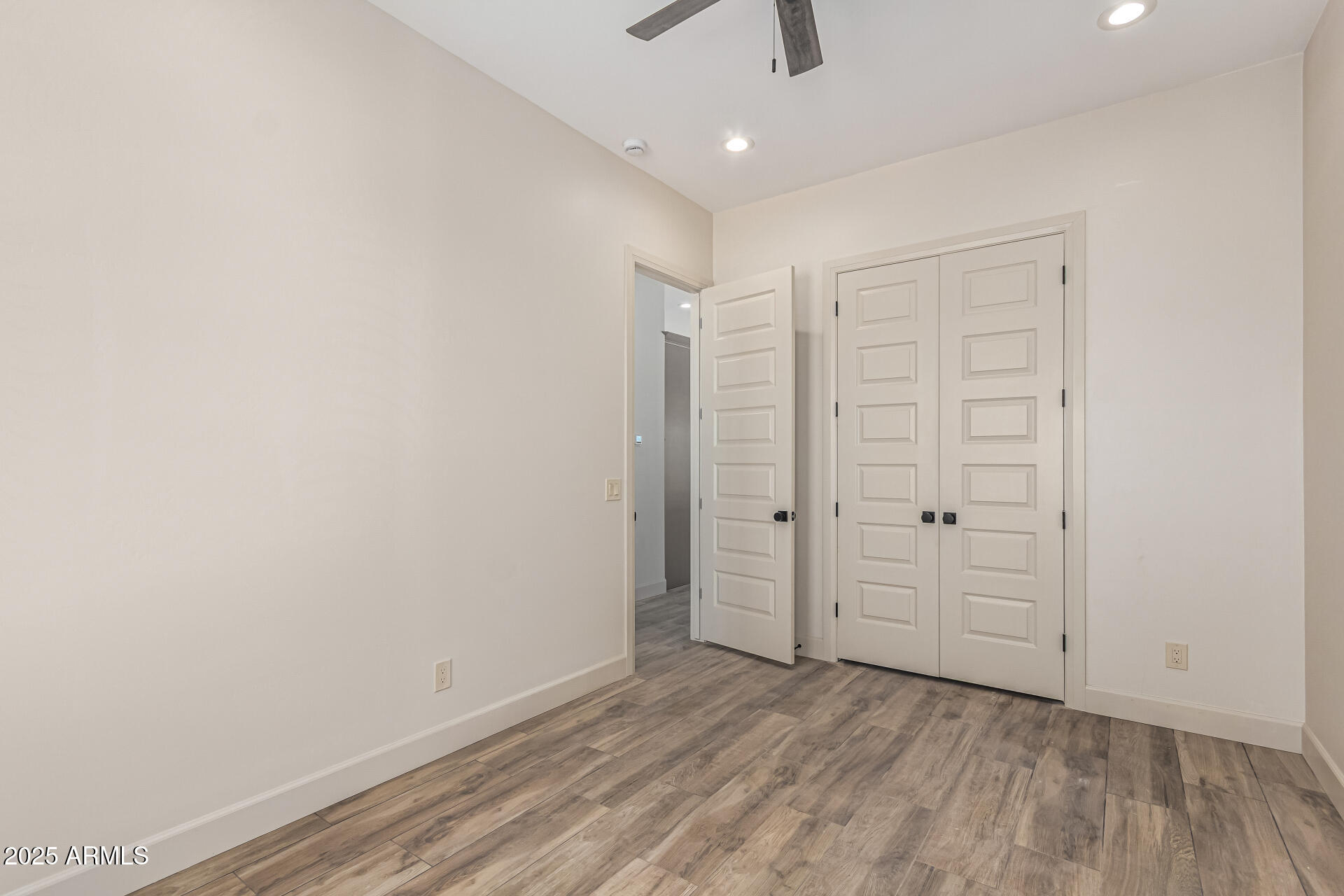 14730 South Rory Calhoun Road Arizona City, AZ 85123 - Photo 23 of 43 wooden floor in an empty room
