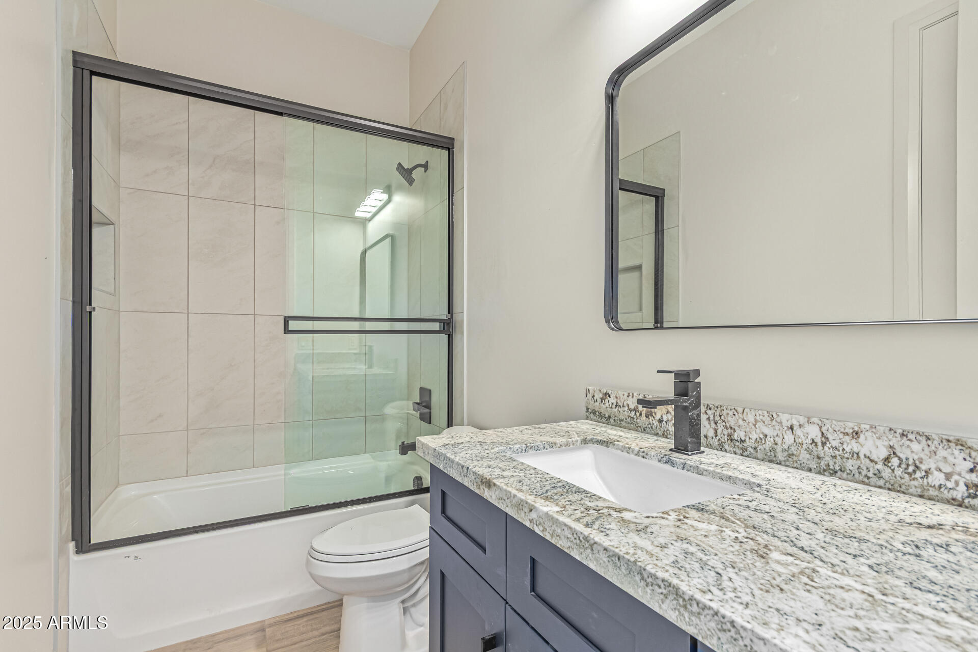 14730 South Rory Calhoun Road Arizona City, AZ 85123 - Photo 24 of 43 a bathroom with a granite countertop sink toilet and shower