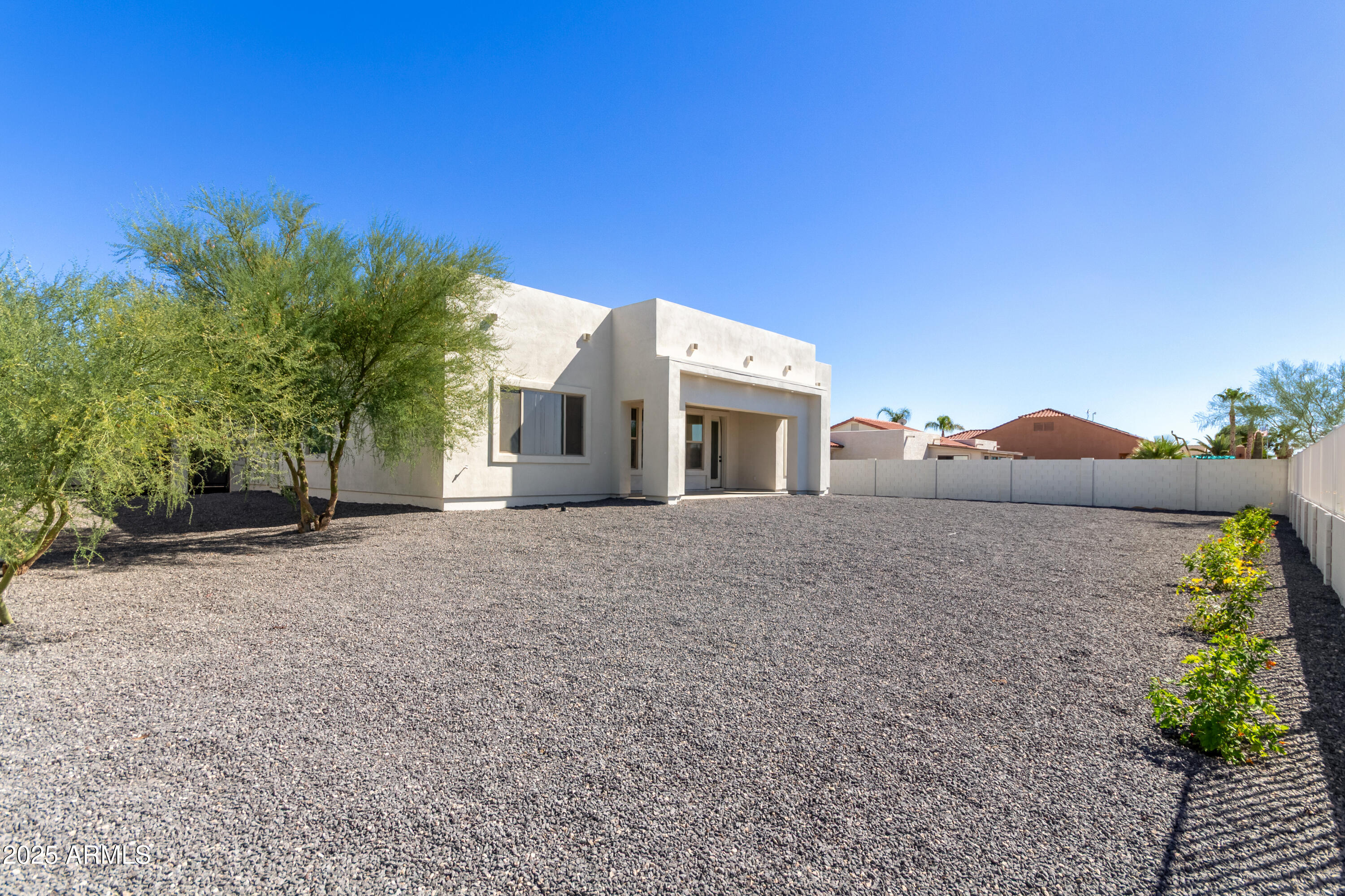 14730 South Rory Calhoun Road Arizona City, AZ 85123 - Photo 31 of 43 a view of house with a yard and a large window