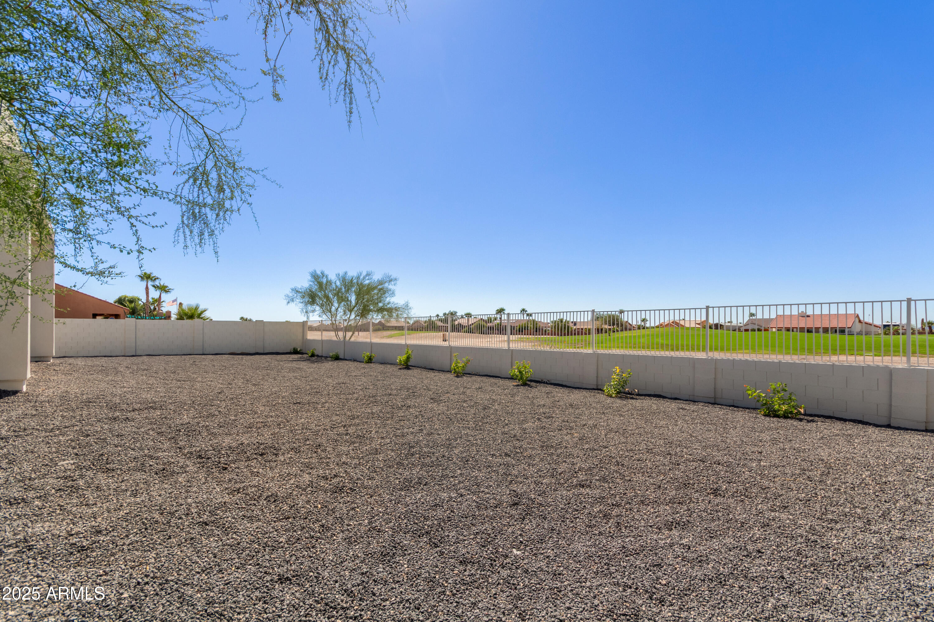 14730 South Rory Calhoun Road Arizona City, AZ 85123 - Photo 32 of 43 a view of a field and trees in the background