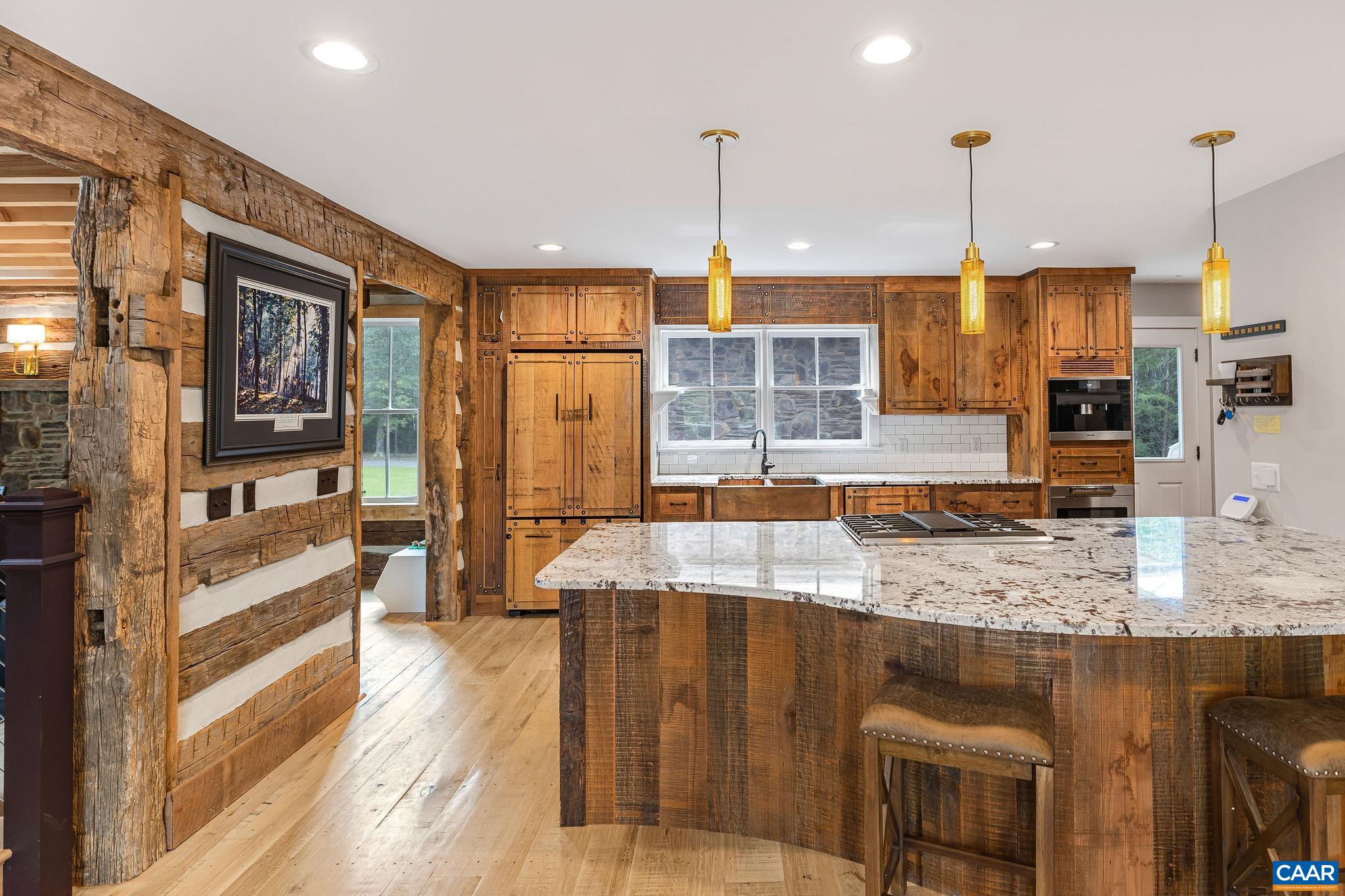 5620 Blenheim Road Charlottesville, VA 22902 - Photo 11 of 59 a kitchen with stainless steel appliances granite countertop sink stove and wooden floor