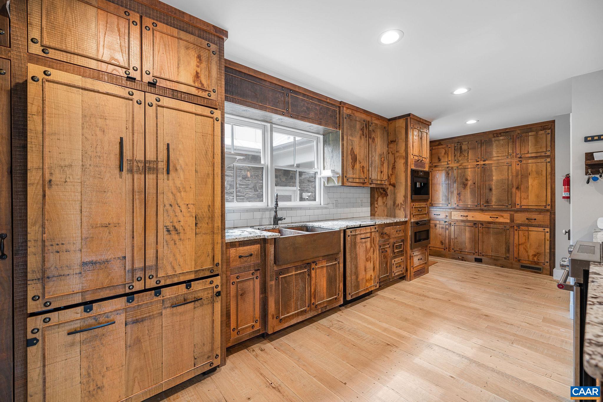 5620 Blenheim Road Charlottesville, VA 22902 - Photo 13 of 59 a kitchen with stainless steel appliances granite countertop a refrigerator and a sink