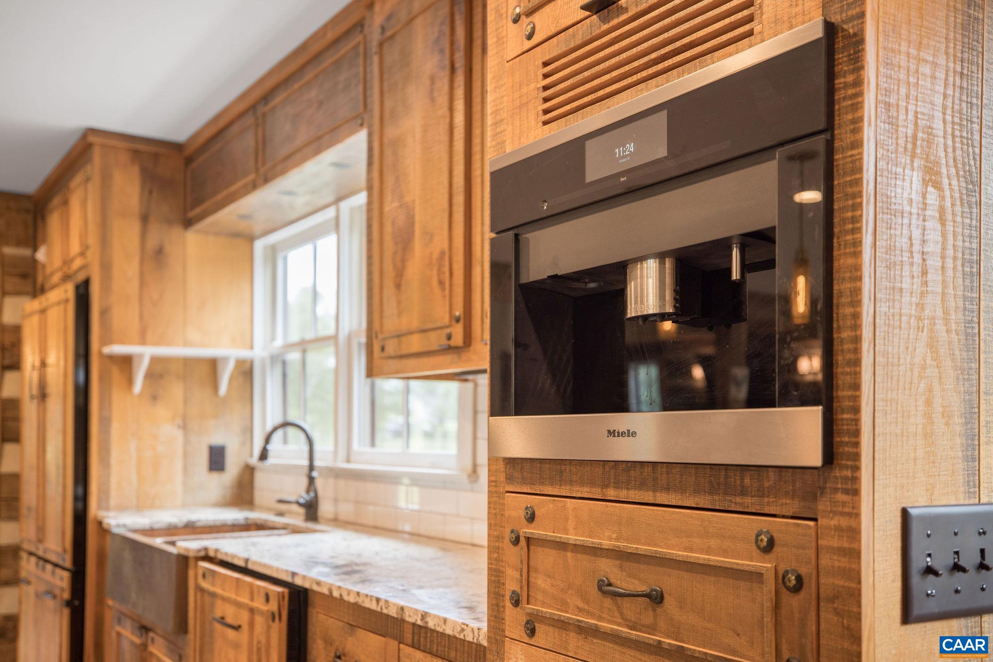 5620 Blenheim Road Charlottesville, VA 22902 - Photo 15 of 59 a kitchen with granite countertop a stove and a sink