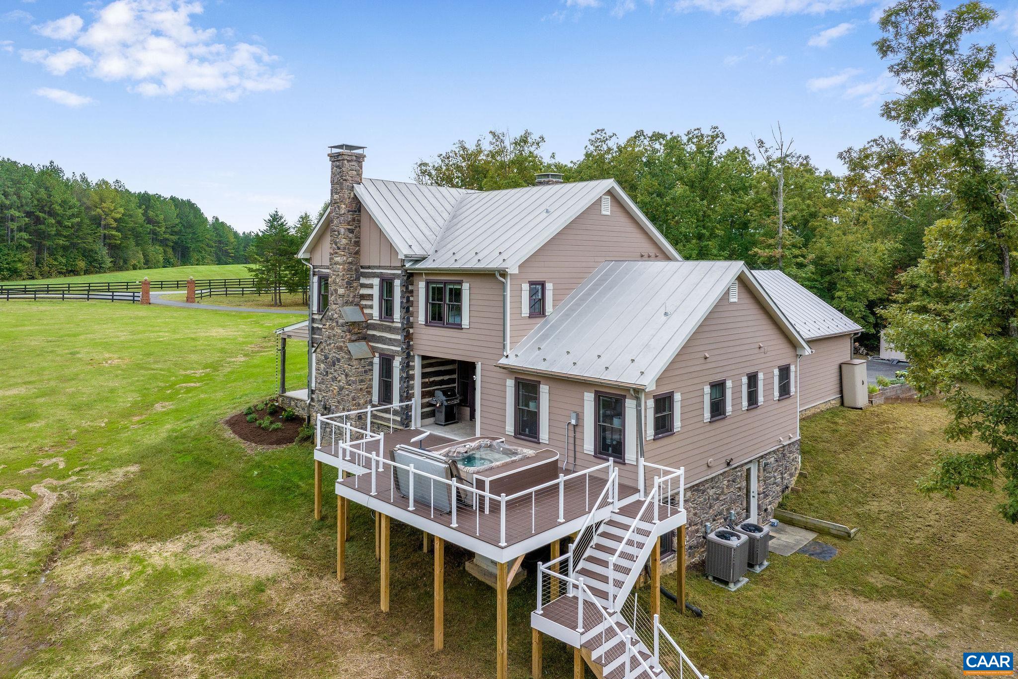 5620 Blenheim Road Charlottesville, VA 22902 - Photo 2 of 59 a aerial view of a house with swimming pool next to a big yard