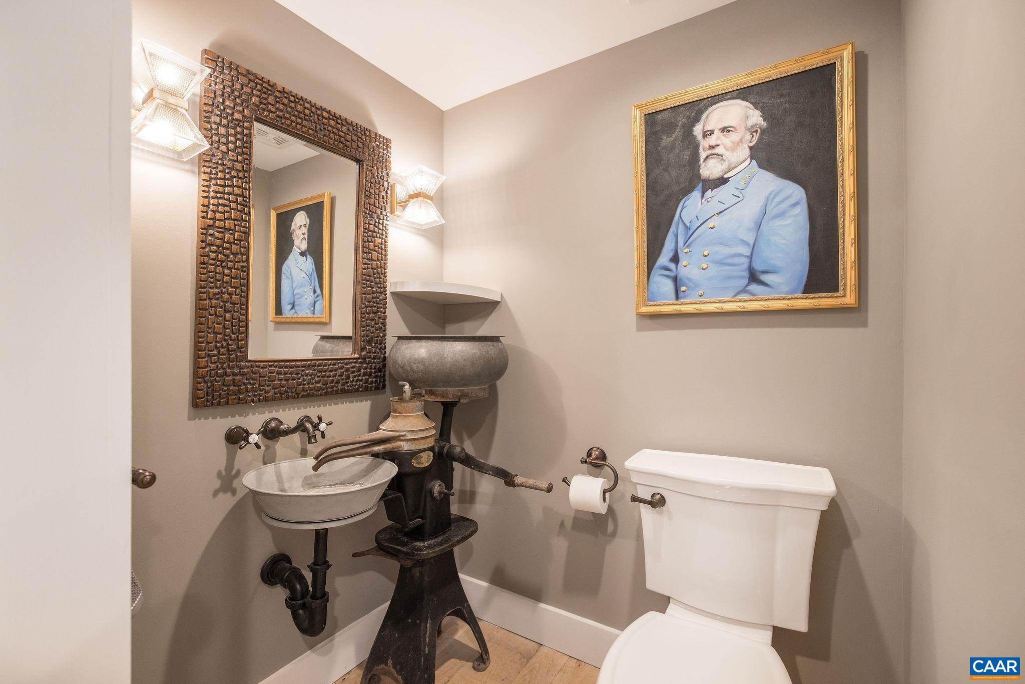 5620 Blenheim Road Charlottesville, VA 22902 - Photo 23 of 59 a bathroom with a toilet a sink and mirror