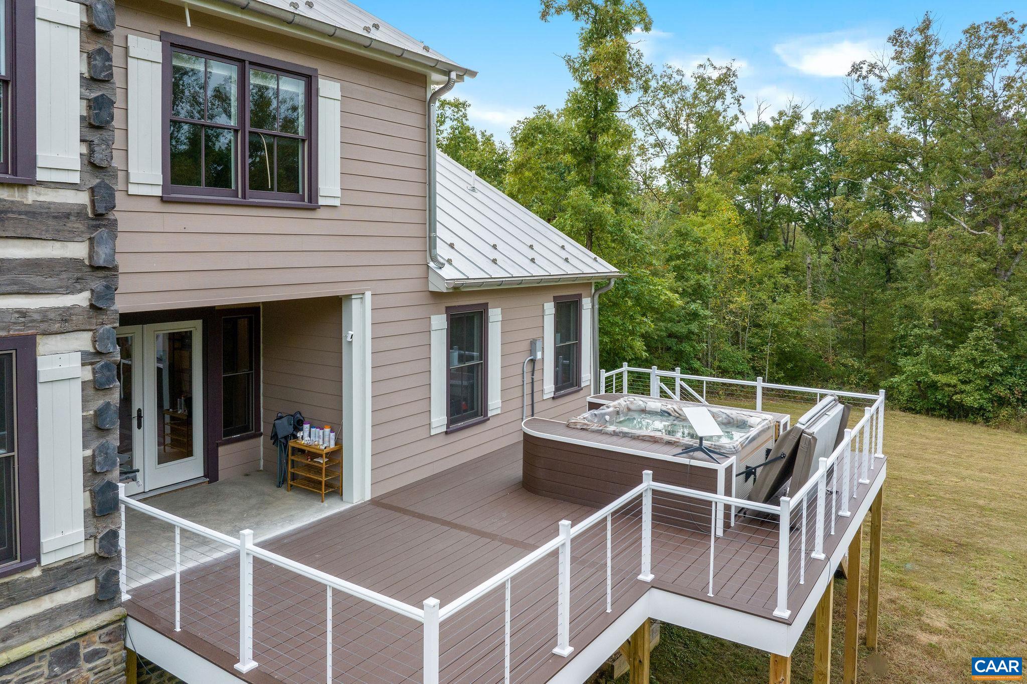 5620 Blenheim Road Charlottesville, VA 22902 - Photo 24 of 59 a view of a patio with table and chairs with wooden floor and fence