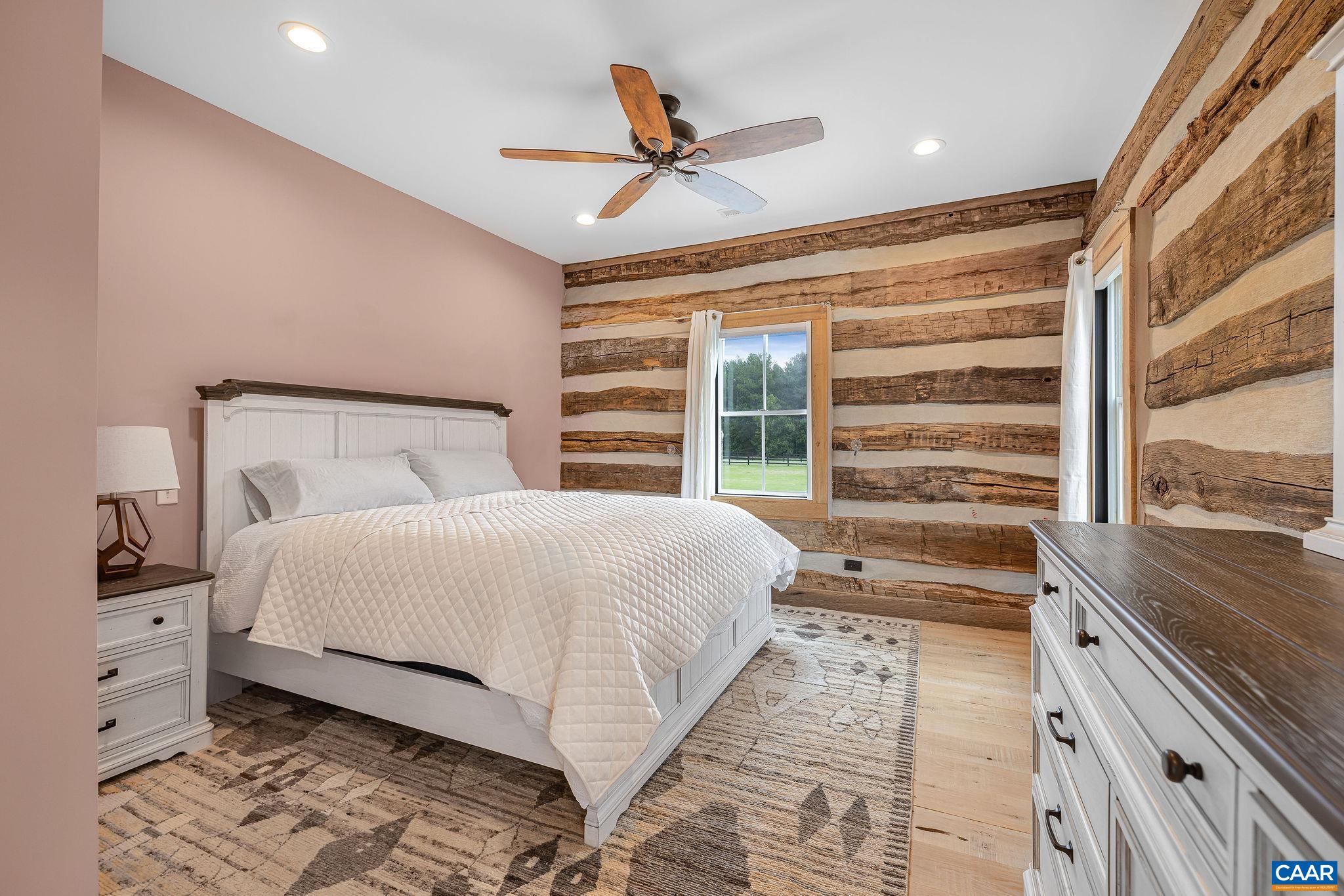 5620 Blenheim Road Charlottesville, VA 22902 - Photo 37 of 59 a bedroom with a large bed and a large window