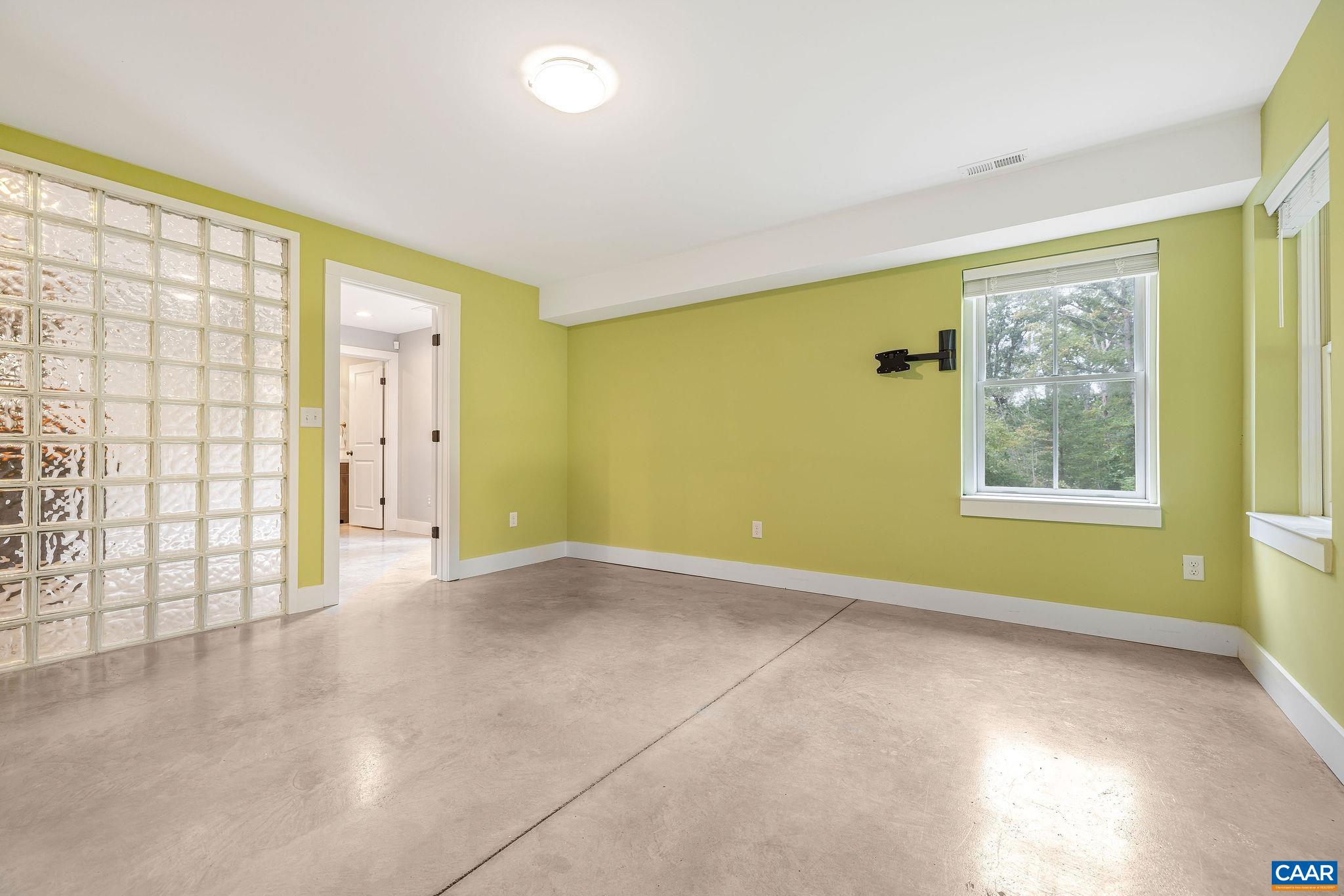 5620 Blenheim Road Charlottesville, VA 22902 - Photo 42 of 59 a view of an empty room with a window