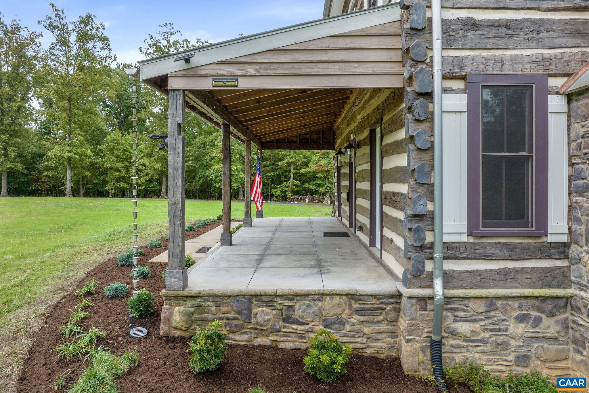 5620 Blenheim Road Charlottesville, VA 22902 - Photo 48 of 59 a view of a porch with a table and chairs