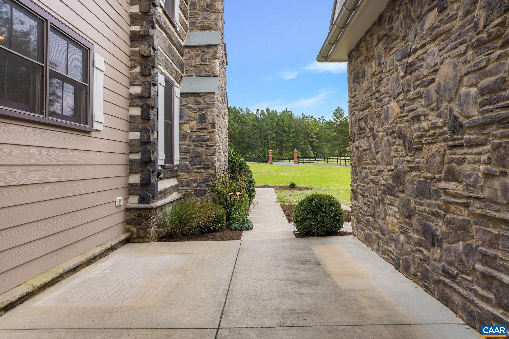 5620 Blenheim Road Charlottesville, VA 22902 - Photo 51 of 59 a view of a garden with pathway and a building