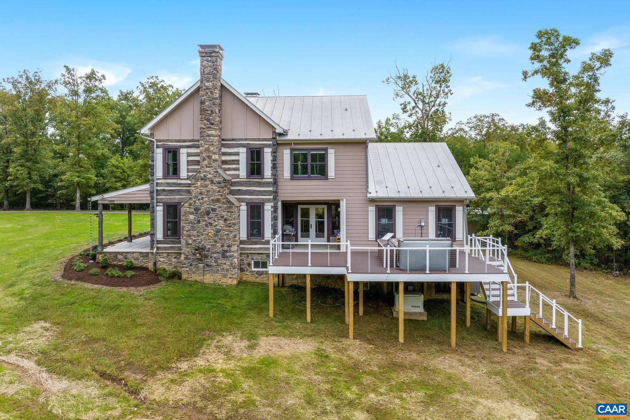 5620 Blenheim Road Charlottesville, VA 22902 - Photo 55 of 59 a aerial view of a house with a yard table and chairs