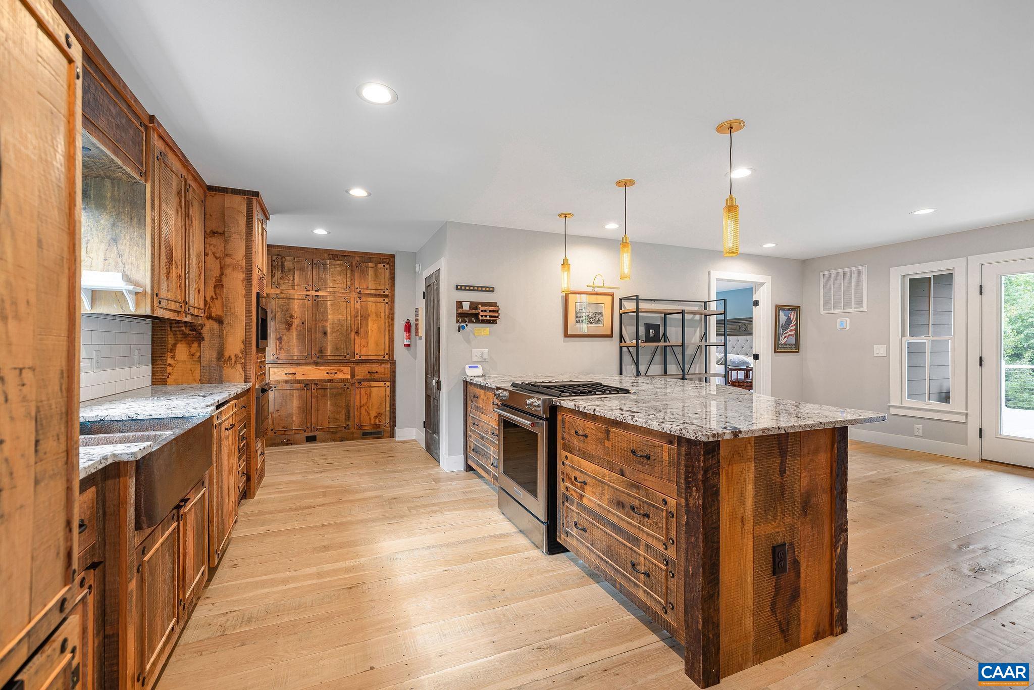 5620 Blenheim Road Charlottesville, VA 22902 - Photo 10 of 59 a large kitchen with stainless steel appliances kitchen island granite countertop a large counter top and stainless steel appliances