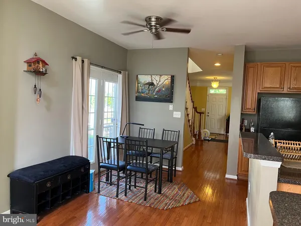 a room with furniture a flat screen tv and a potted plant