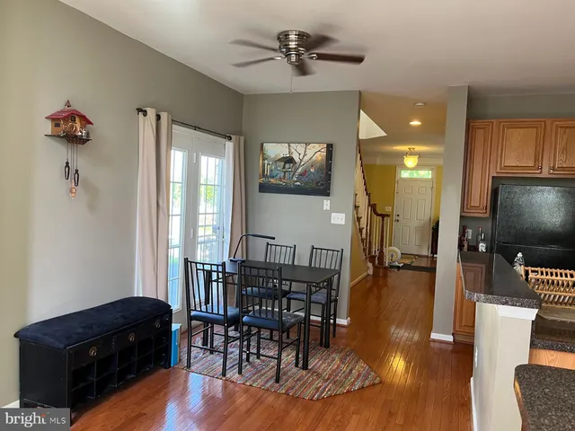 a room with furniture a flat screen tv and a potted plant