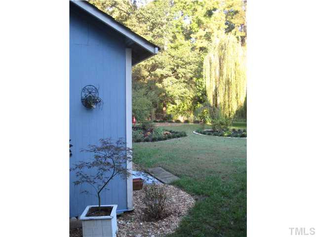 157 Ridge Drive Garner, NC 27529 - Photo 19 of 25 The view as you enter from the side yard...welcome home!