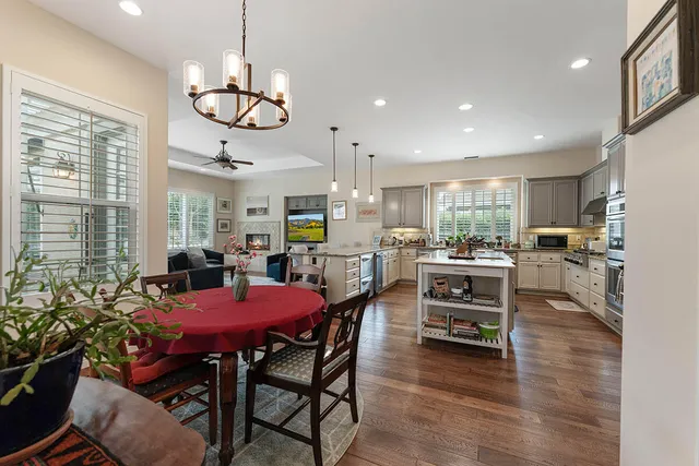 a living room with furniture a air conditioner and a window