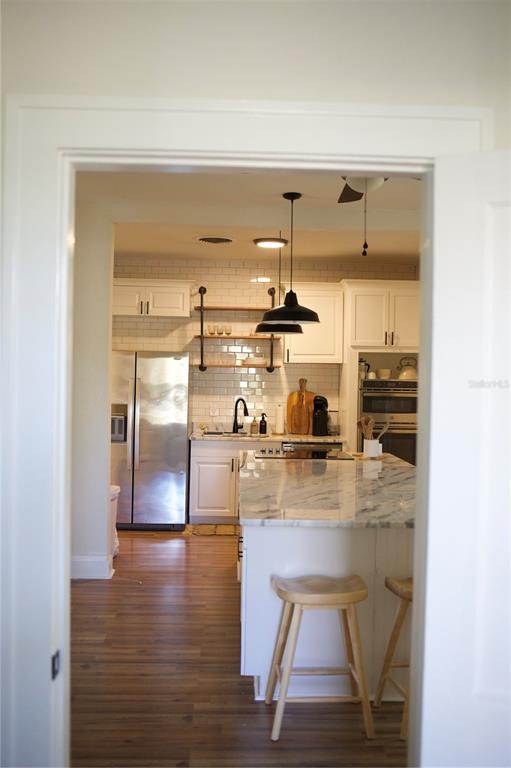 1126 Ruby Street Lakeland, FL 33815 - Photo 15 of 38 a kitchen with wooden floor