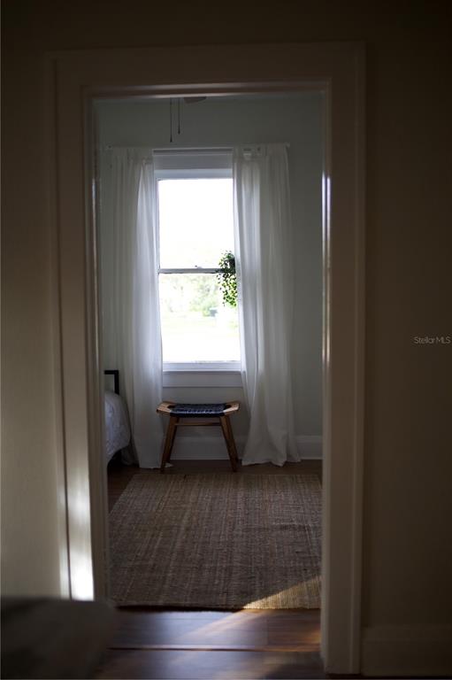 1126 Ruby Street Lakeland, FL 33815 - Photo 19 of 38 a room with a window and a wooden floor