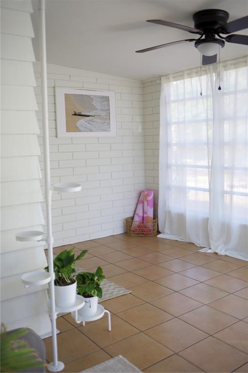 1126 Ruby Street Lakeland, FL 33815 - Photo 2 of 38 a view of a room with wooden walls and potted plants