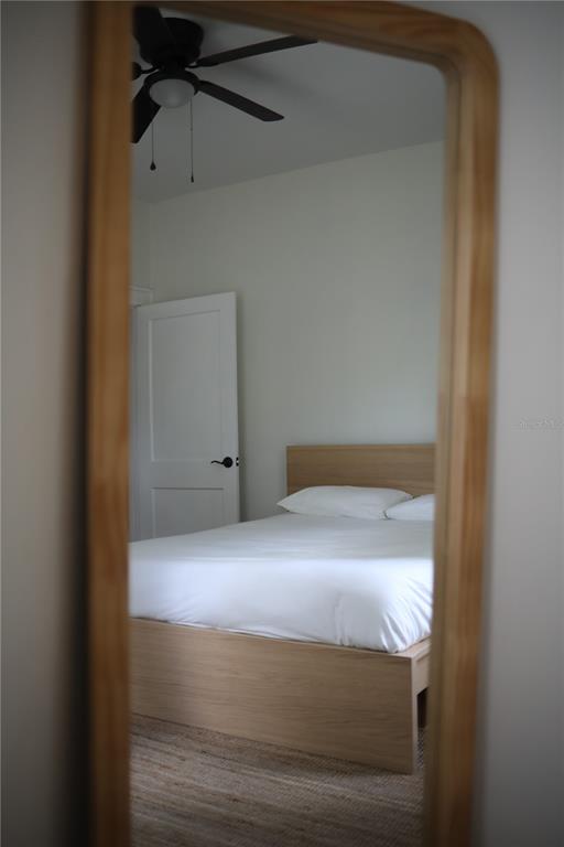 1126 Ruby Street Lakeland, FL 33815 - Photo 25 of 38 a bedroom with a bed and a window