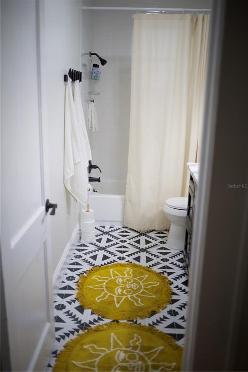 1126 Ruby Street Lakeland, FL 33815 - Photo 26 of 38 a bathroom with a tub and toilet