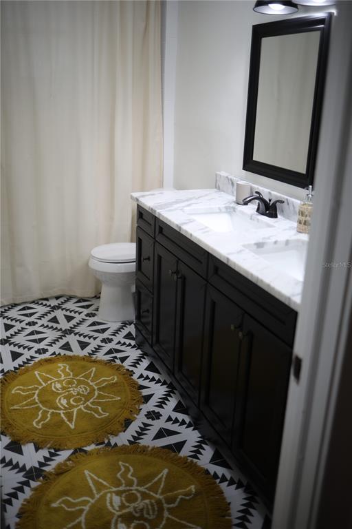 1126 Ruby Street Lakeland, FL 33815 - Photo 28 of 38 a bathroom with a sink and a mirror