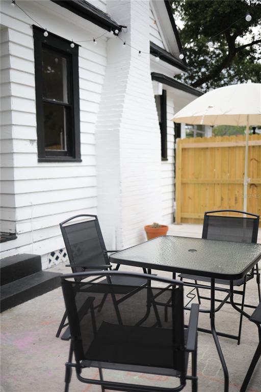1126 Ruby Street Lakeland, FL 33815 - Photo 37 of 38 a backyard of a house with table and chairs