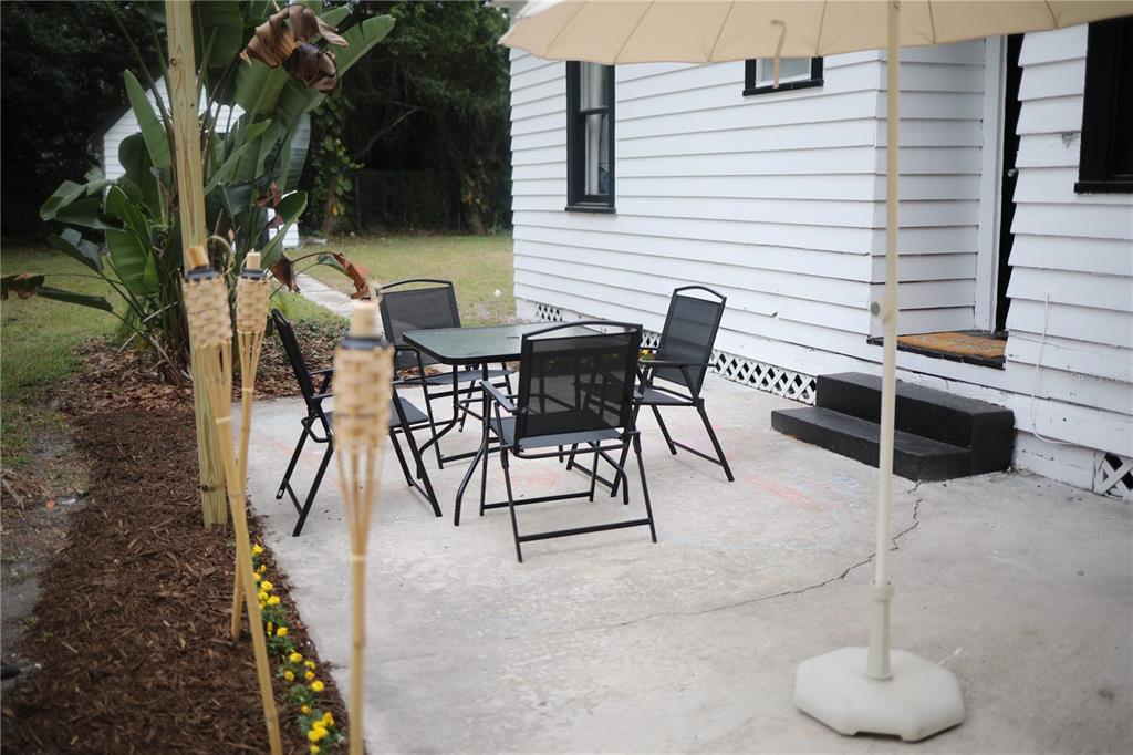 1126 Ruby Street Lakeland, FL 33815 - Photo 38 of 38 a view of a terrace with furniture and a potted plant