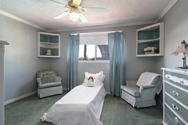 a bedroom with a bed and a couch