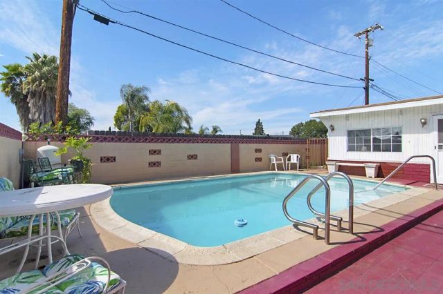 a view of a swimming pool with a chairs