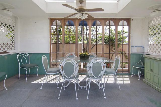 a view of a dining room with furniture wooden floor and chandelier