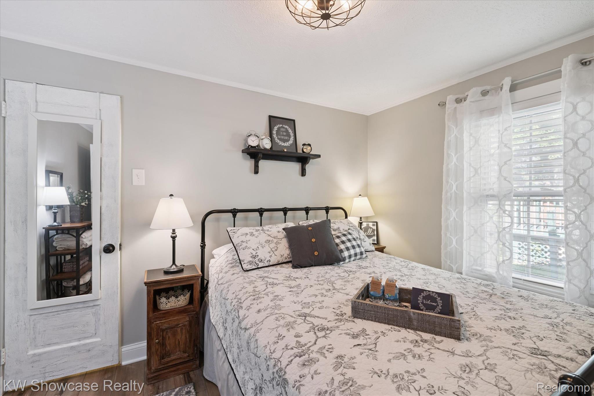 603 West Clinton Street Howell, MI 48843 - Photo 18 of 25 Bedroom featuring dark wood-type flooring and baseboards