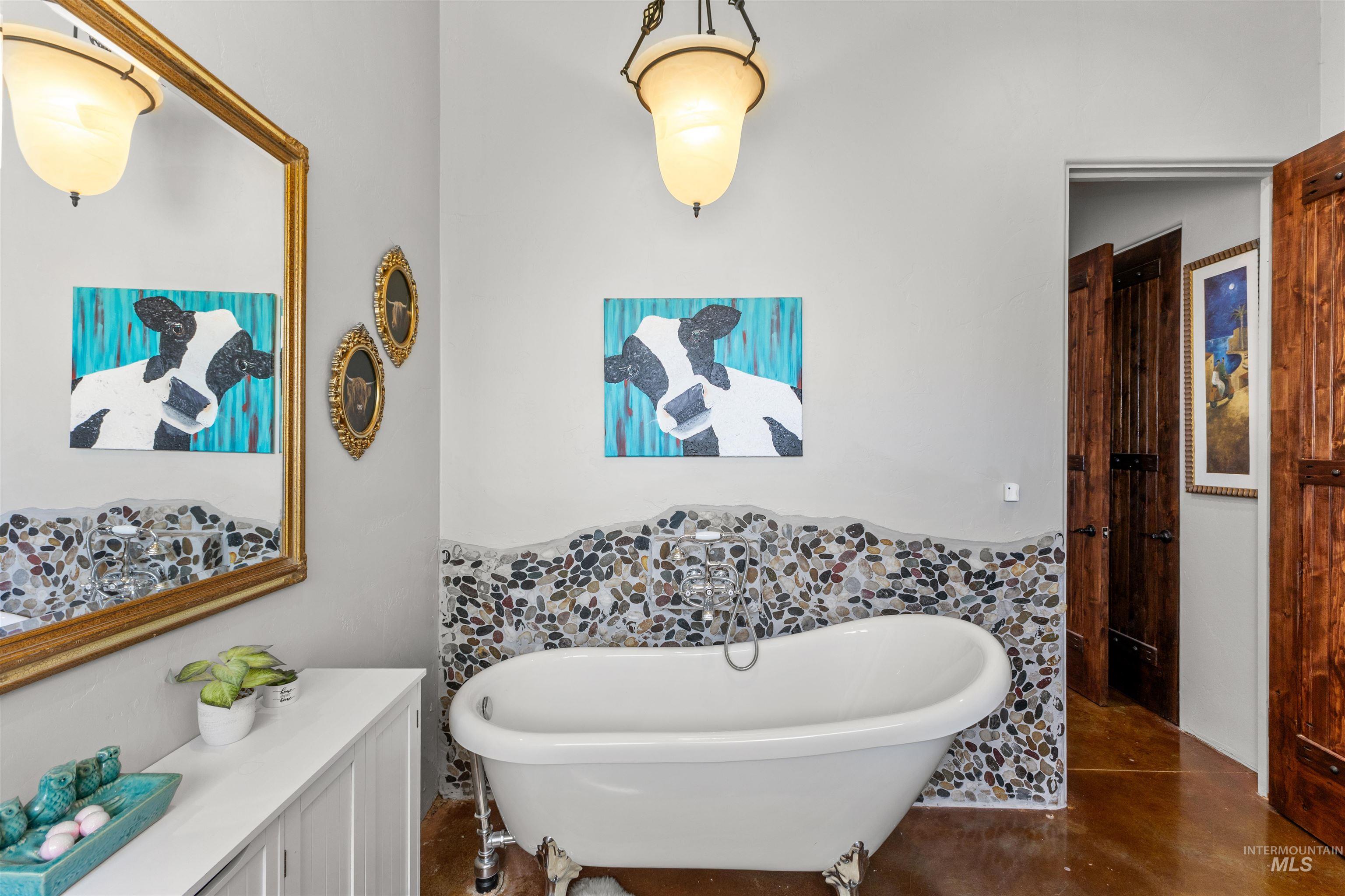 1030 Desert Glen Road Adrian, OR 97901 - Photo 23 of 47 Freestanding clawfoot tub with a stone tile surround