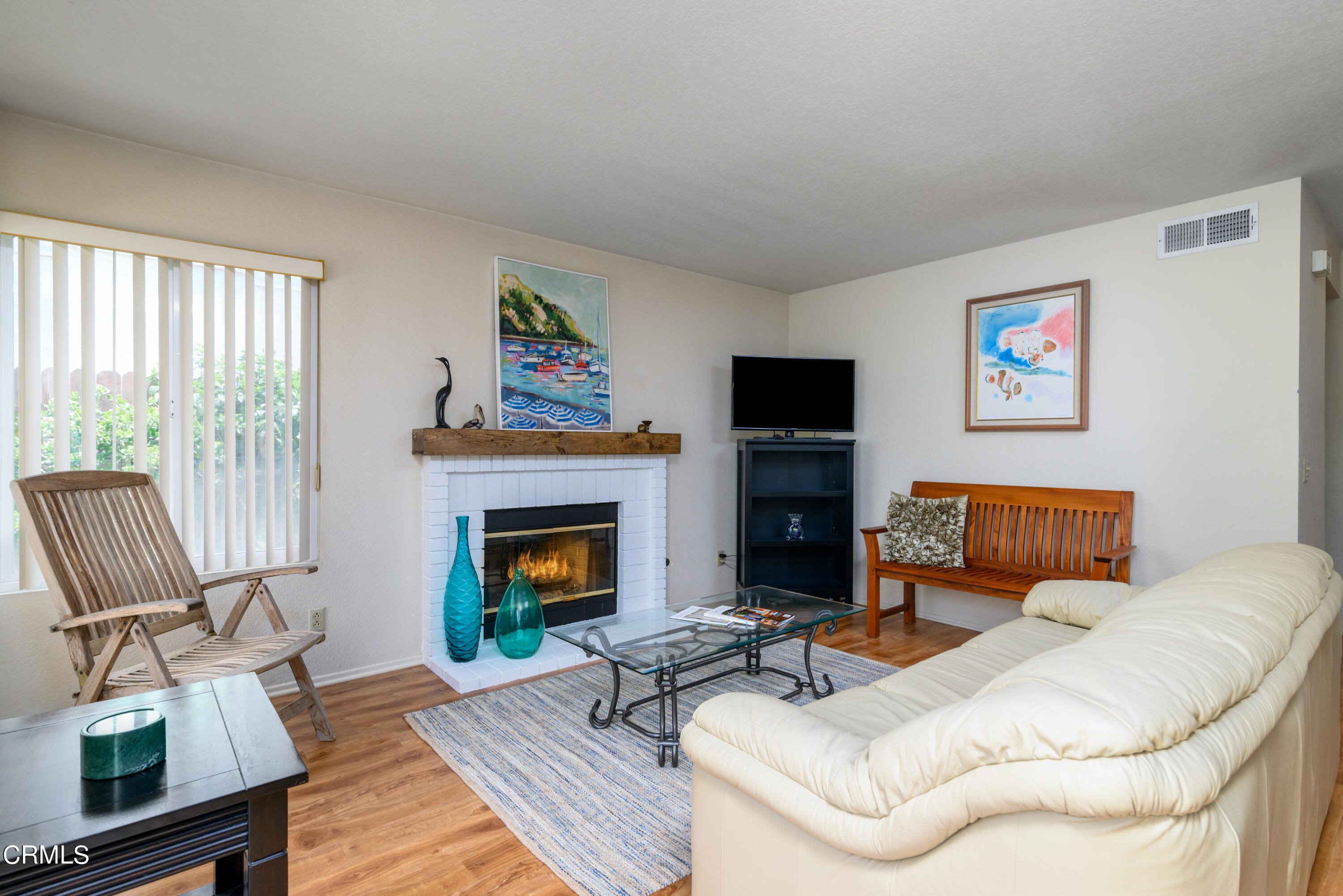 6175 Palomar Circle Camarillo, CA 93012 - Photo 14 of 25 a living room with furniture a fireplace and a flat screen tv