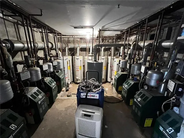 a living room with lots of furniture and a fireplace