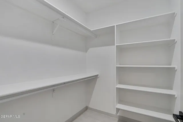 a view of an empty walk in closet