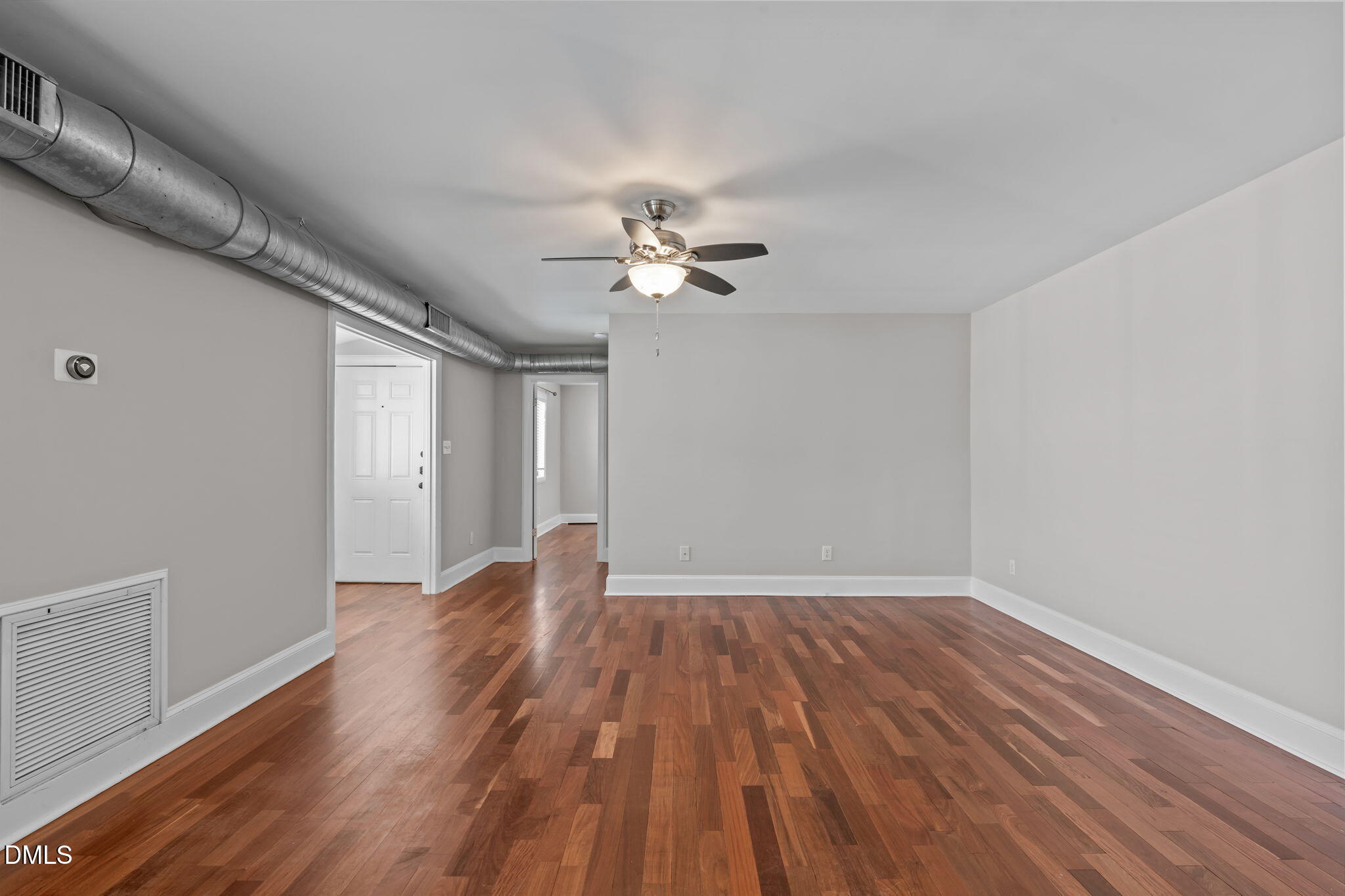 2208 Stafford Avenue Raleigh, NC 27607 - Photo 6 of 30 wooden floor in an empty room with a window