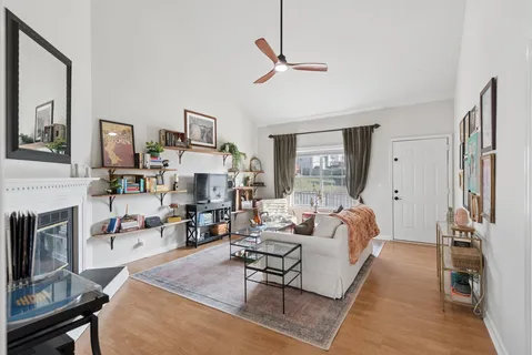 a living room with furniture and a fireplace