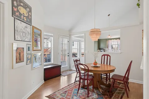 a view of a dining room with furniture window and wooden floor